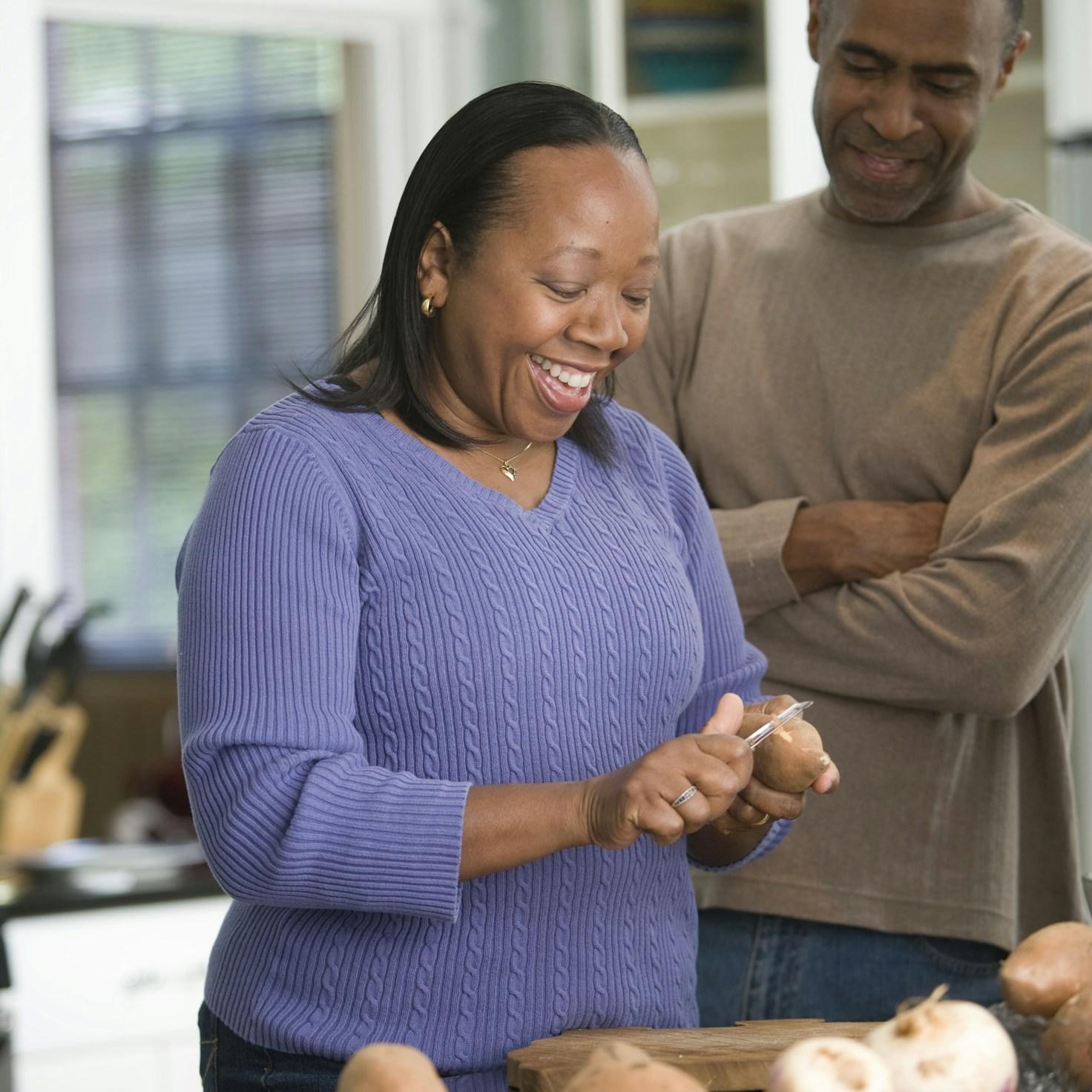 Community members collaborating in a modern kitchen space, sharing recipes and cooking techniques